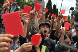a group of slogan chanting demonstrators